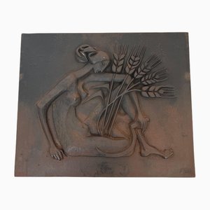 Modernist Cast Iron Fireback Depicting a Nude Woman Holding a Scythe and Ears of Wheat