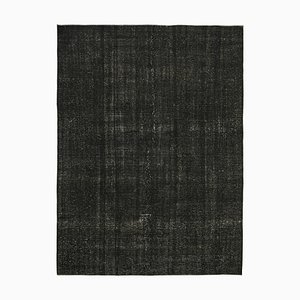 Schwarzer handgeknüpfter Teppich