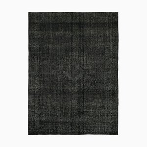 Schwarzer handgeknüpfter Teppich
