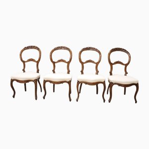 Sillas de comedor de nogal tallado, mediados del siglo XIX. Juego de 4