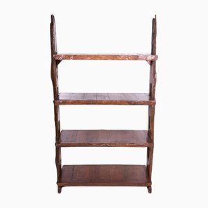 Librería étnica de madera de teca con acabado en bruto