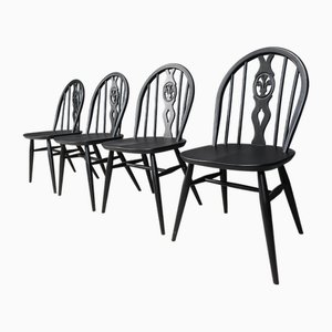 Sillas de comedor vintage ebonizadas de Ercol, años 50. Juego de 4