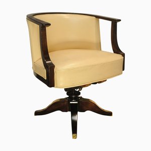 French Art Deco Cream Leather Swivelling Tub Desk Chair with Rail Swept Arm Supports with Cast Iron Mechanism in the style of Ej Ruhlmann