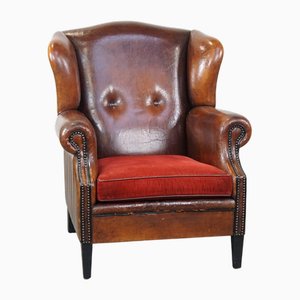 Vintage Leather Wing Chair with Red Corduroy Seat Cushion