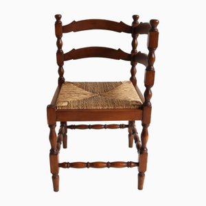 Sedia ad angolo antica in legno tornito con sedile in giunco intrecciato, anni '30