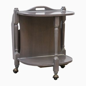 Carrello in legno con portariviste