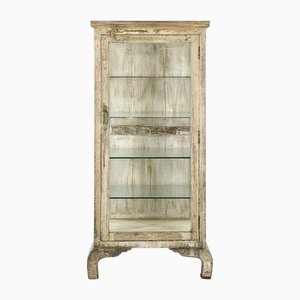 Vitrina con patas de madera con pátina beige