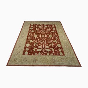 Middle Eastern Wool Rug in Light Red with Gold-Colored Accents