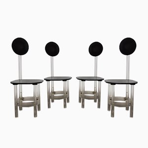 Sillas de comedor esculturales de vidrio acrílico negro y transparente, años 70. Juego de 4