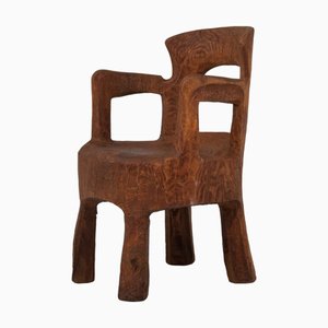 Silla escultural de madera tallada a mano