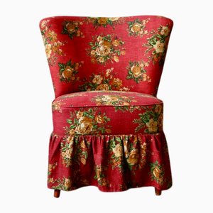 Poltrona Cocktail con tessuto floreale rosso e gambe a compasso