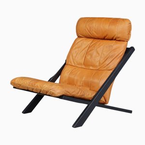 Poltrona in legno e pelle color cognac di Ueli Berger per de Sede, Svizzera, anni '70.