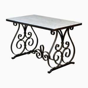 Mesa de centro de hierro forjado con tablero de mármol, años 30