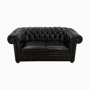 Sofá de dos plazas Chesterfield de cuero negro, años 60