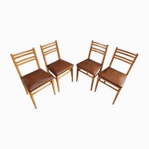 Sillas de comedor francesas vintage de haya y vinilo marrón, años 50. Juego de 4