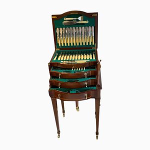 Cubertería antigua con soporte, década de 1890
