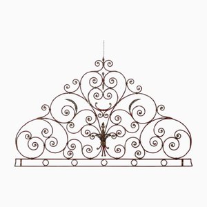 Testata letto matrimoniale in ferro rosso, inizio XX secolo