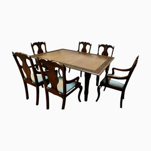 Mesa de comedor y sillas talladas, años 20. Juego de 7