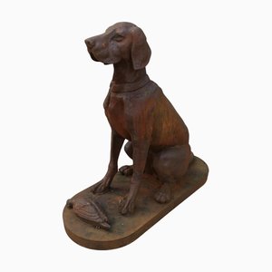 Estatua de hierro fundido de perro de caza recuperando un faisán, años 60