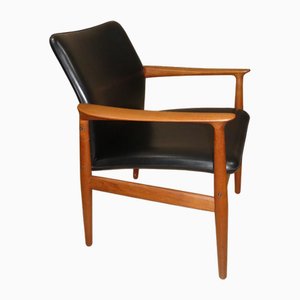 Dänischer Sessel aus Teak & schwarzem Skai Leder von Grete Jalk für Glostrup, 1960er