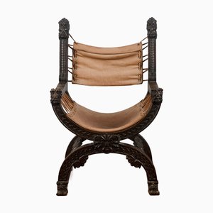 Folding Armchair in Leather and Carved Wood, 1920s