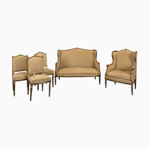 Asientos de salón estilo Luis XVI de madera dorada. Juego de 5