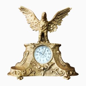 Reloj de repisa con águila de latón, años 20