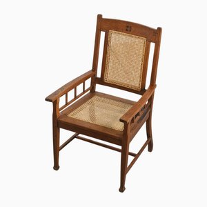 Cane Armchair in Stained Oak, United Kingdom, 1920s