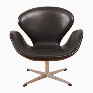 Model 3320 Swan in Cast Aluminum, Four-Star Base with Plastic Gliders, Shell Padded and Covered with Black Leather by Arne Jacobsen for Fritz Hansen, 1958