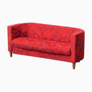 Sofá de tres plazas de tela roja con estampado floral, años 60
