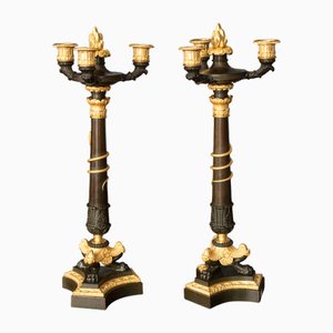 Candeleros Imperio de bronce dorado. Juego de 2