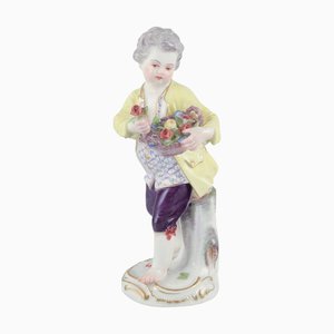 Porcelain Figurine of Boy with Basket of Flowers from Meissen, Germany. 1900s