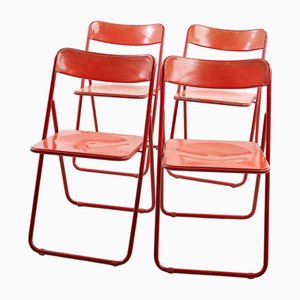 Sillas plegables rojas, años 60. Juego de 4