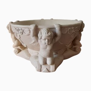 Centro de mesa con decoración Putti