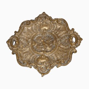 Centro de mesa de placa de bronce que representa a Cupido