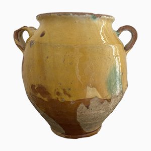 Vaso di grasso giallo e verde