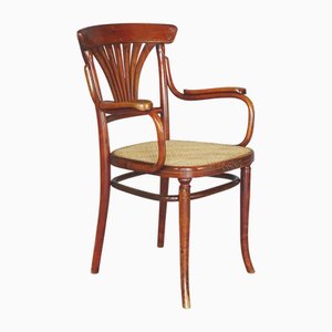 Poltrona N°221 con intarsi in bronzo e canna di Michael Thonet, 1910