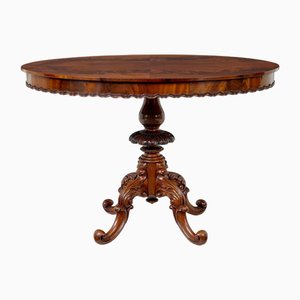 Antique Carved Flame Mahogany Oval Center Table, 1890s