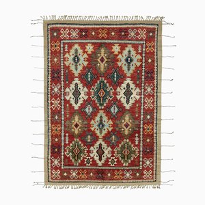 Moderner roter Tribal Teppich