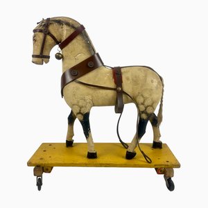 Cavallo su ruote in legno intagliato e dipinto a mano, inizio XX secolo