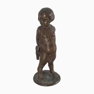 Escultura de un niño con flechas en bronce, 1922