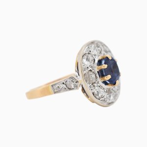 Anillo vintage de oro, zafiro y halo de diamantes, años 70