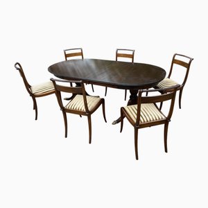 Mesa vintage de caoba con sillas, años 70. Juego de 7