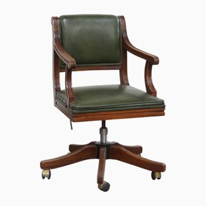 Silla de oficina inglesa de cuero de vaca con ruedas combinadas con madera