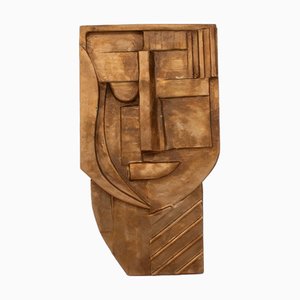 Cabeza escultural de madera dorada, años 80