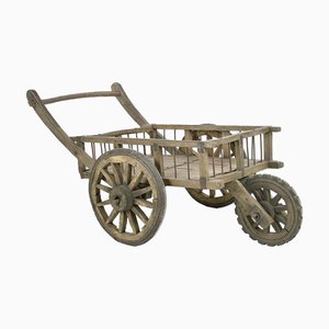 Weathered Wooden Cart with Three Wheels
