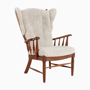 High Back Armchair in Oak and Sheep Skin Upholstery by Axel Einar Hjorth, Denmark, 1970s