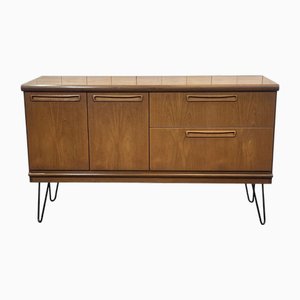 Credenza in teak con gambe a compasso in metallo nero, anni '70
