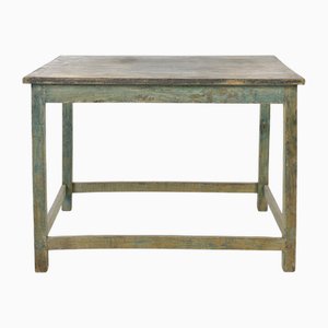 Mesa de madera con pátina verde