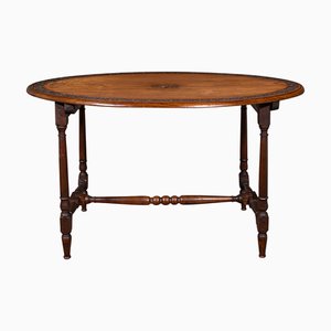 Mesa de comedor Campaign inglesa oval de nogal, década de 1900